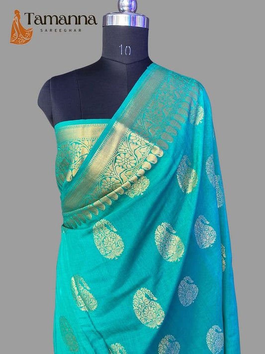 Turquoise silk saree with gold woven pallu border and leaf-like motifs