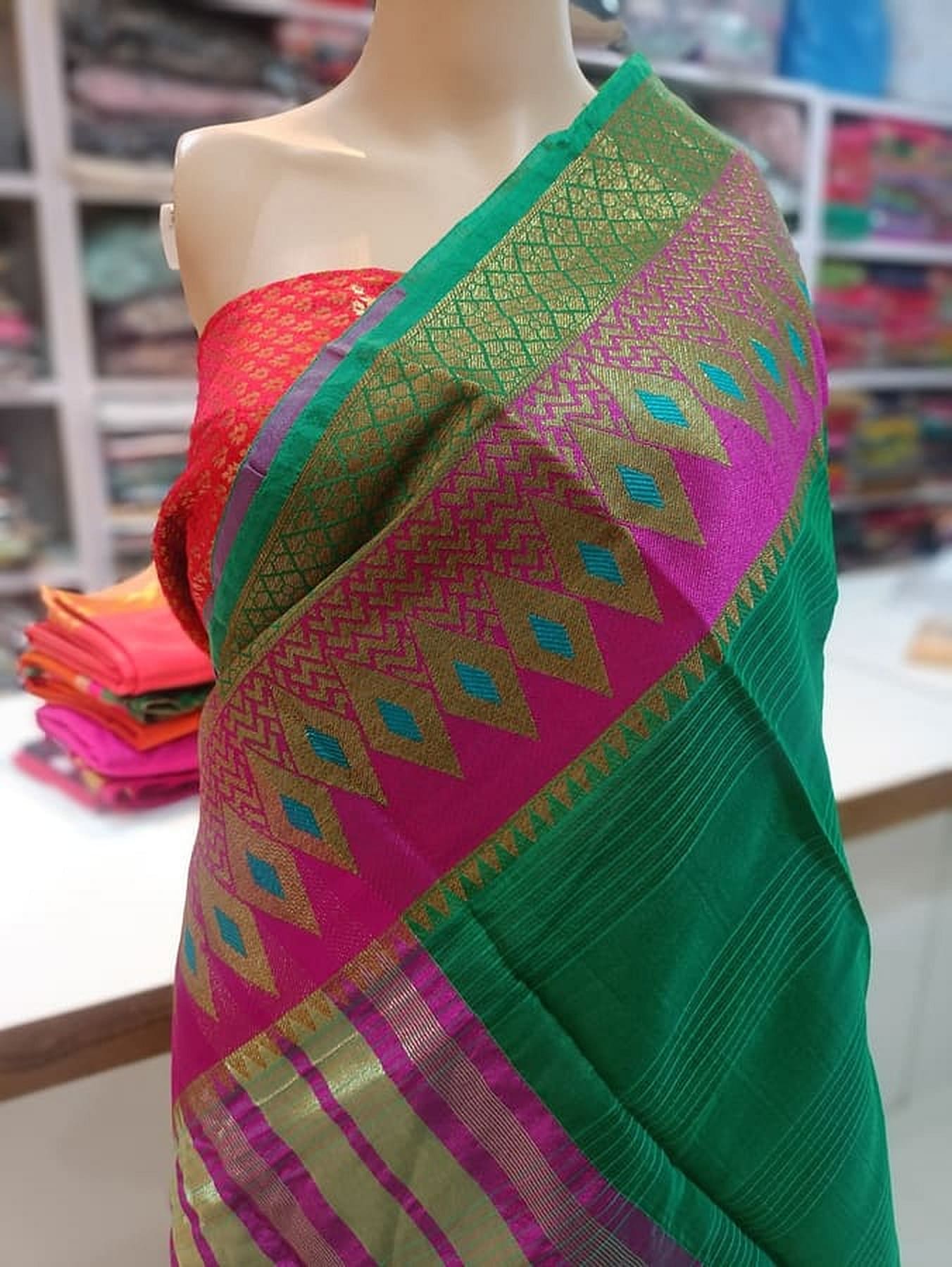 Green and magenta pure silk saree with geometric zigzag pattern panel and gold border