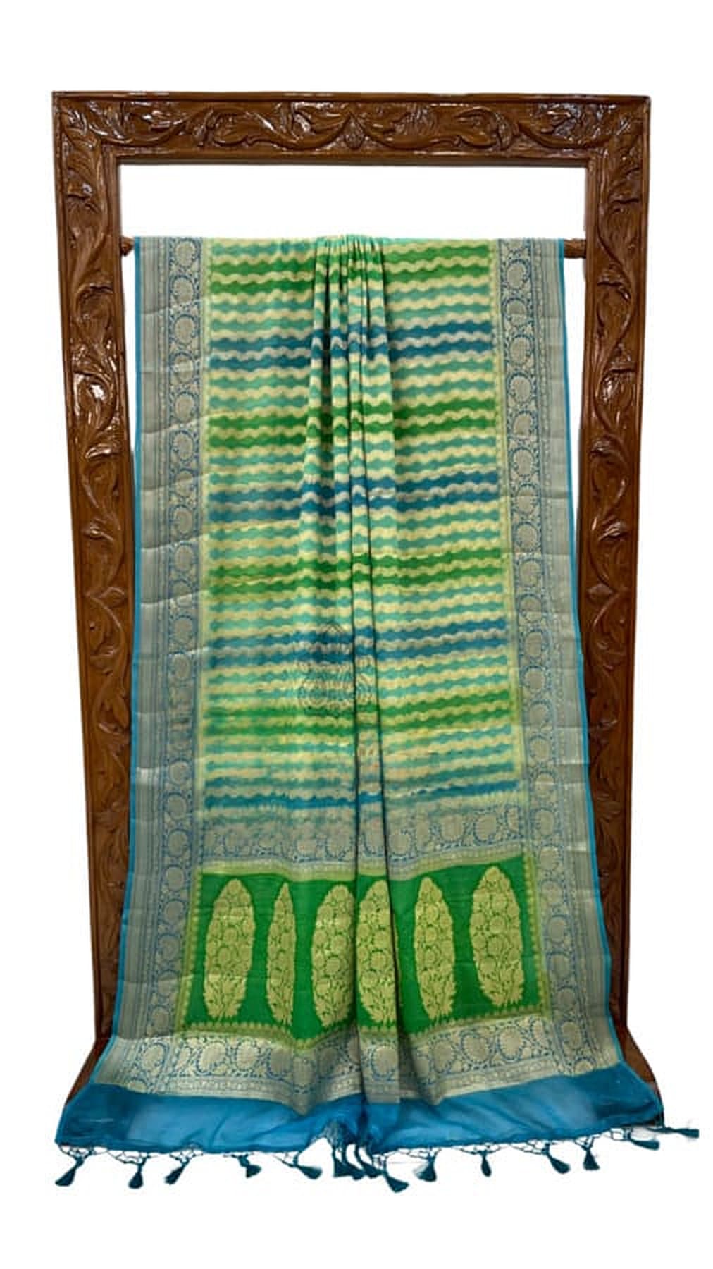 Green saree with blue border, striped center panel and tassel-trim hem