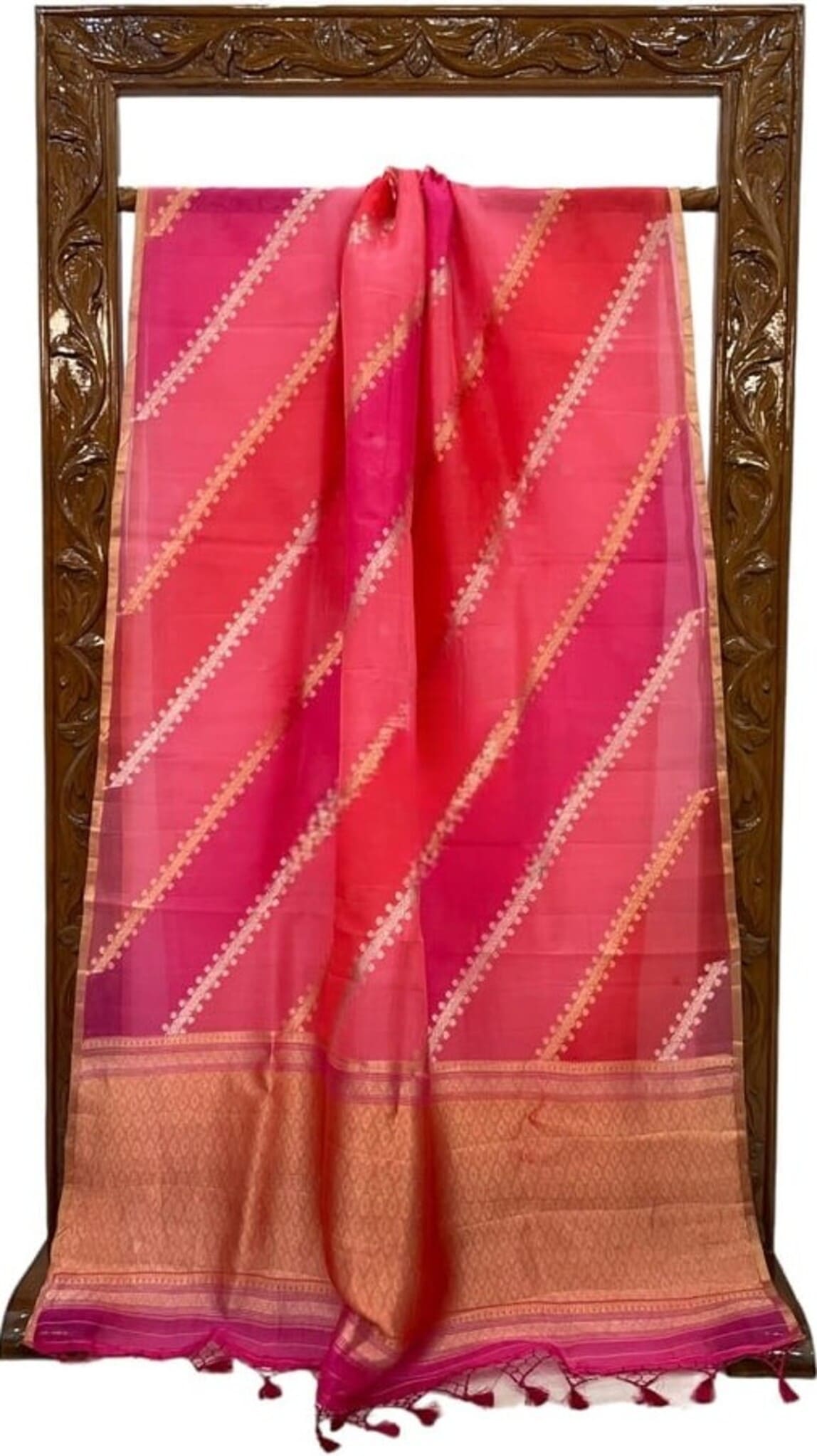 Pink saree with gold and white diagonal pattern, copper-gold border and tassel hem