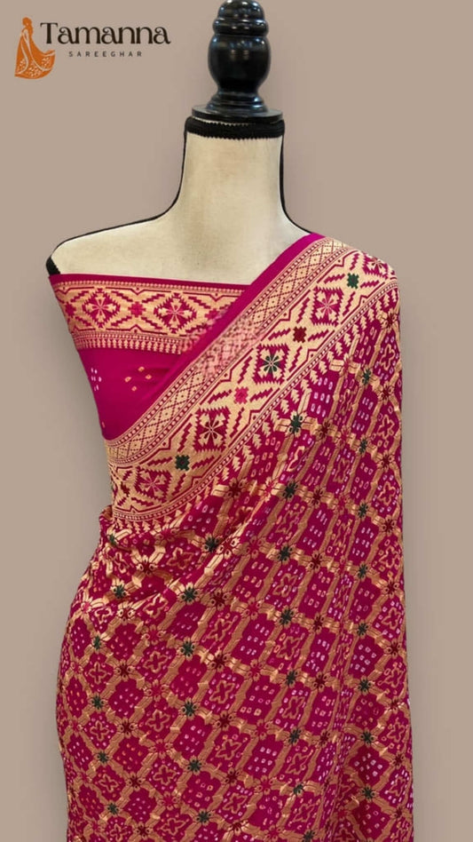 Magenta saree drape with gold lattice pattern, decorated pallu border and ornate detailing