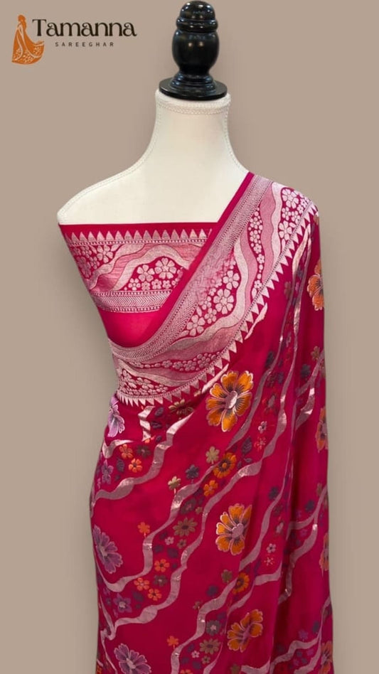 Red Banarasi saree featuring pink border, silver vine pattern, floral accents on pallu