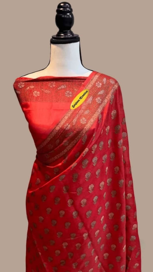 Red saree with gold butta motifs and contrasting woven border pallu