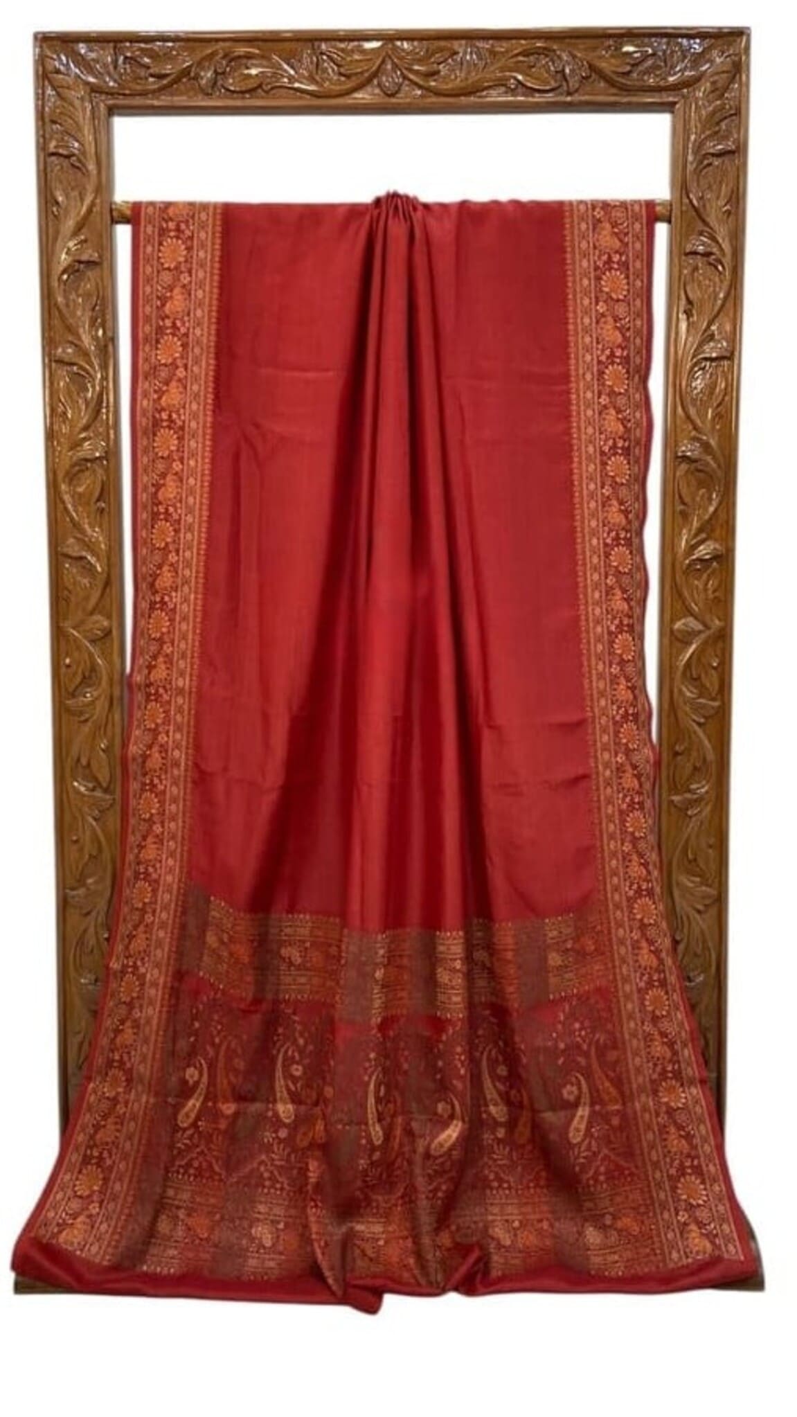 Red crepe Banarasi saree, full length view with gold-toned patterned border and hem