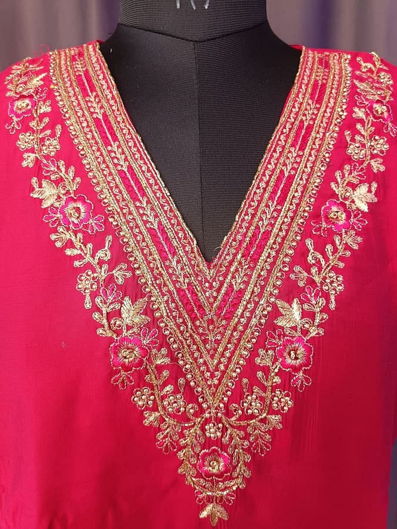 Magenta kurta with heavy gold floral V-neck embroidery and decorative neckline