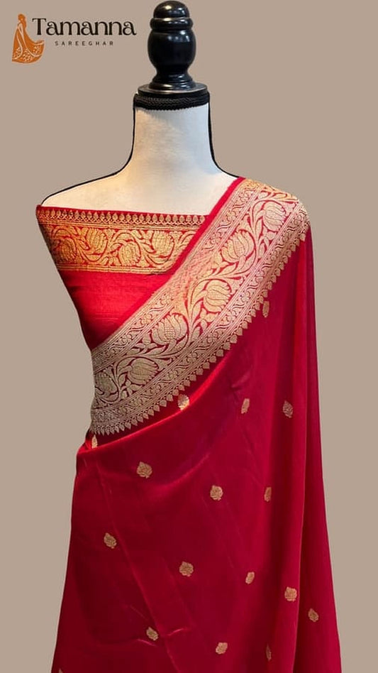 Red draped saree with gold-toned woven pallu and allover small motifs