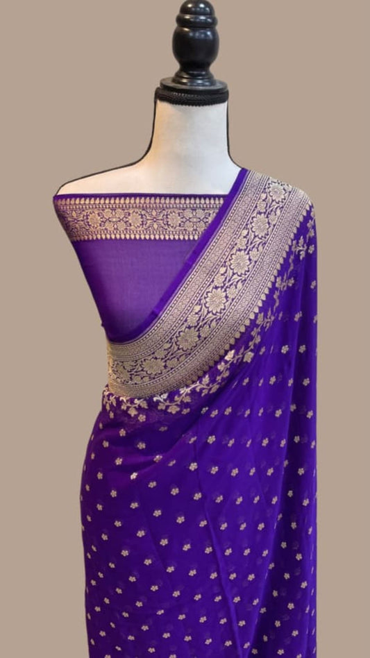 Purple georgette saree with gold zari pallu border and small allover motif print