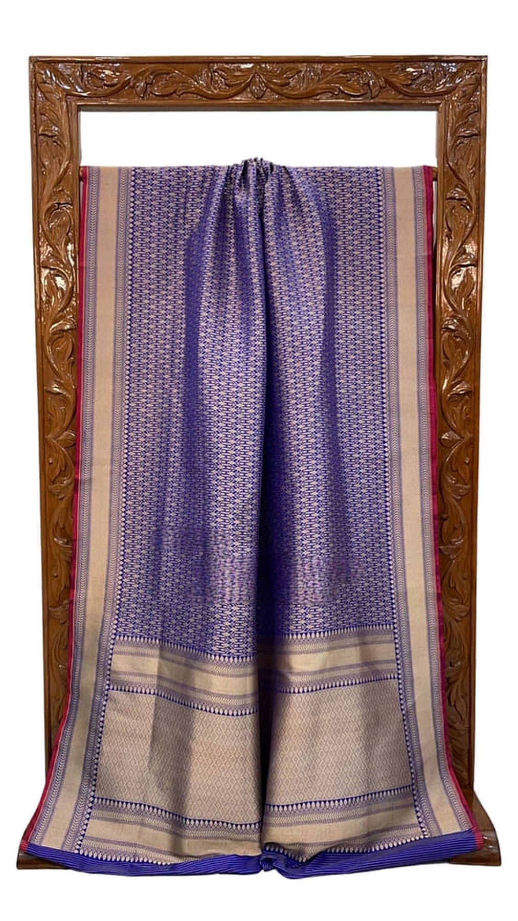 Royal blue Banarasi silk saree with gold striped border and maroon-red edging, pleats