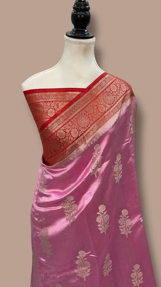 Magenta silk saree with red zari border, cream pallu and gold floral pattern