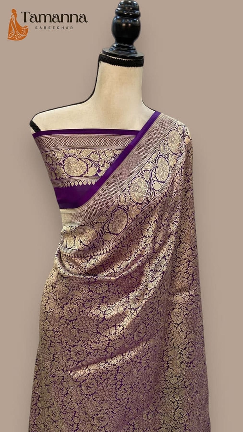 Mauve silk saree with purple edging and circular gold zari designs