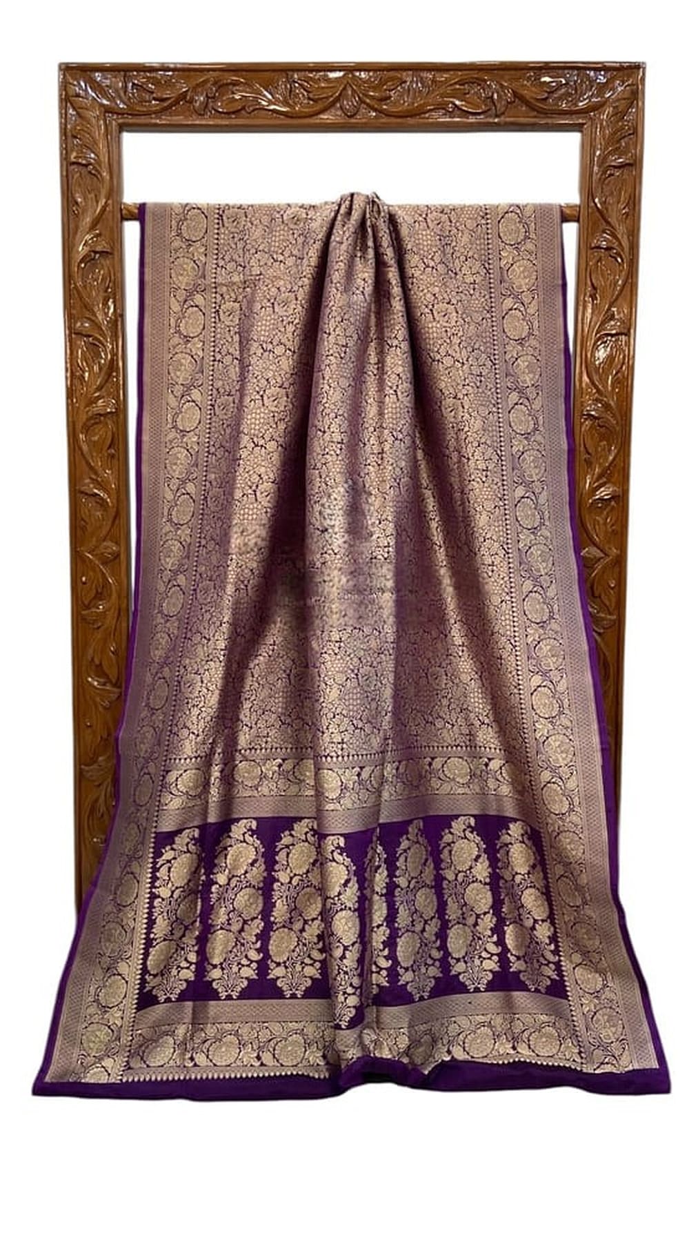 Draped saree with gold brocade pattern and dark purple border