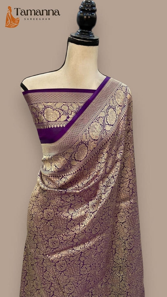 Mauve saree with dark purple pallu border and ornate gold motifs