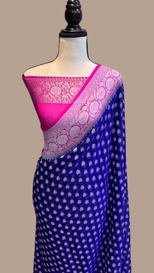 Royal blue and pink Banarasi saree with small dot motifs and pink woven border drape