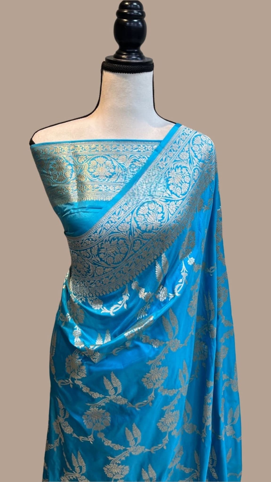 Sky-blue katan silk saree with gold jaal work and draped pallu, zari border trim