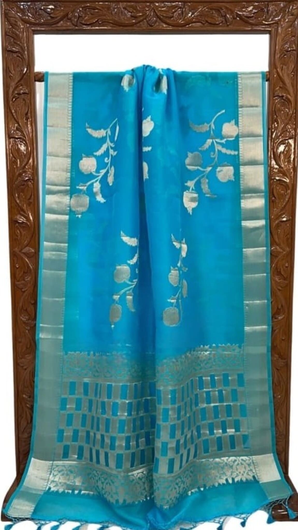 Sky blue Banarasi saree with gold-toned border, off-white floral pattern and check hem