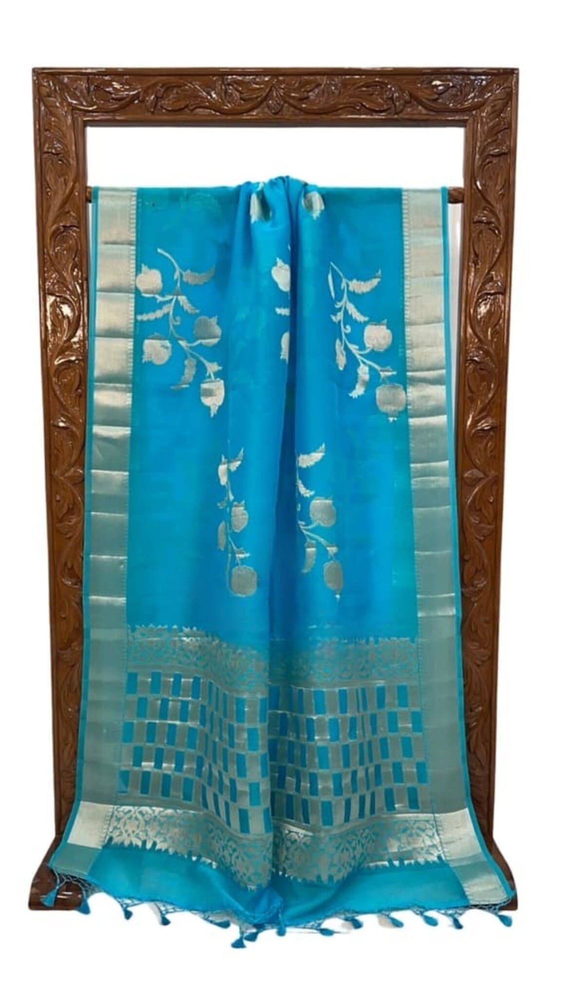 Sky blue Banarasi saree with gold border, off-white floral motifs and turquoise check work hem