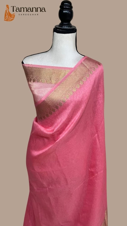 Strawberry pink linen Banarasi saree with gold zari border, draped on mannequin