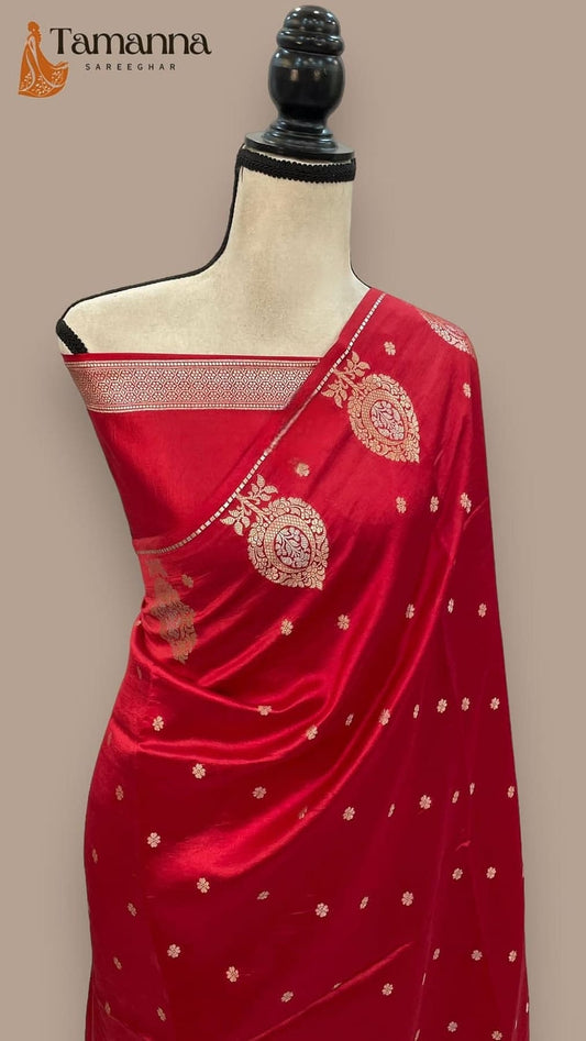 Red silk saree with gold border and circular zari motifs on pallu, mannequin view