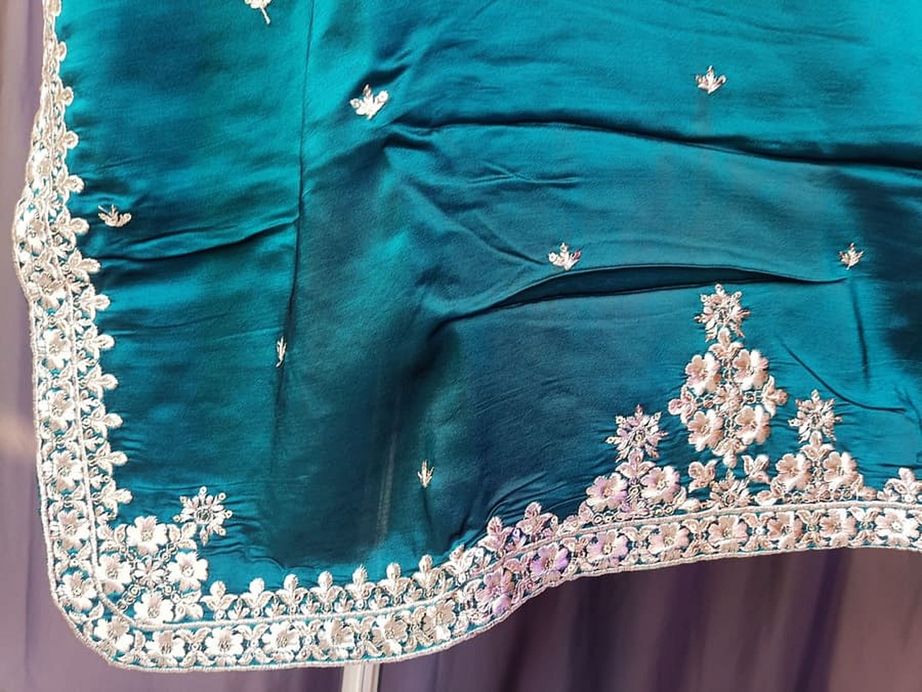 Teek blue silk kurta side hem with silver floral border and small motifs