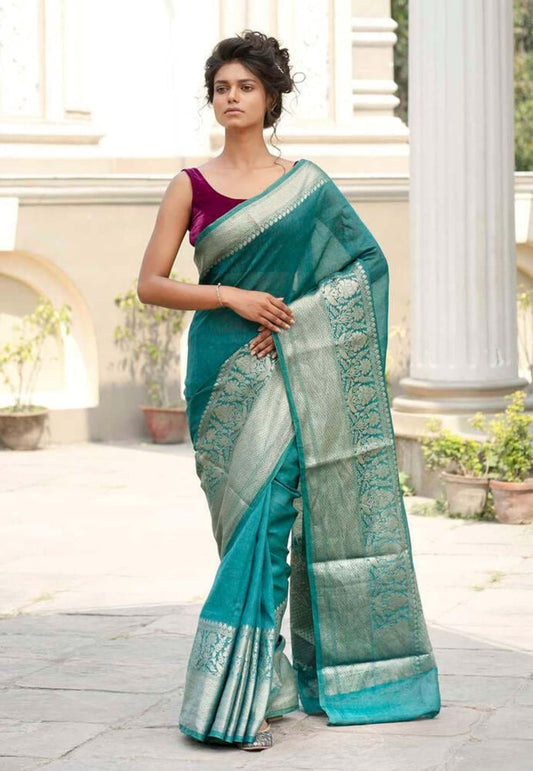 Teal green linen saree in full drape with light green embroidered border