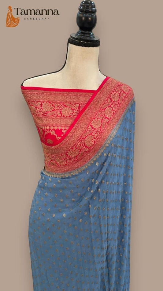 Turquoise blue crepe saree with red pallu and antique zari border, draped