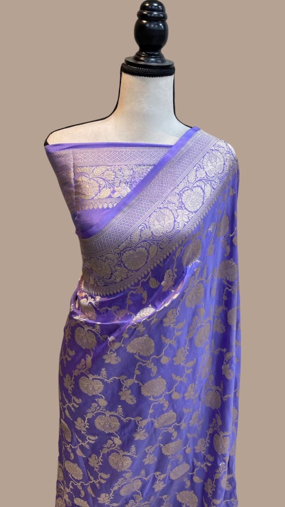 Banarasi silk saree with woven gold patterns, blue body and light lavender border on pallu