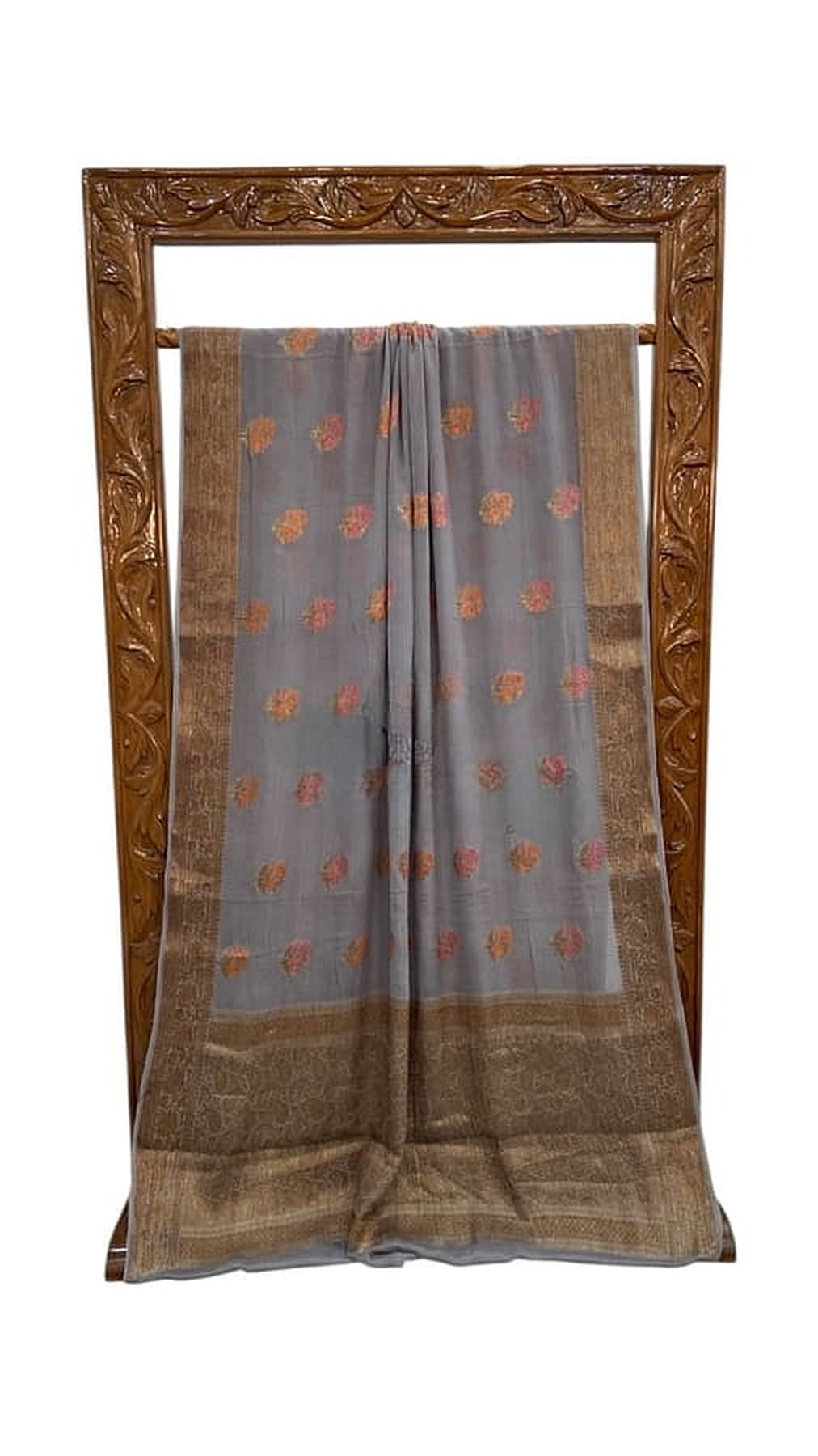 Grey chiffon saree with gold-brown border, multicolor floral print, neatly pleated