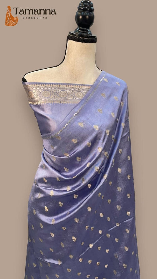 Mannequin drape of navy silk saree with gold border and scattered small motifs