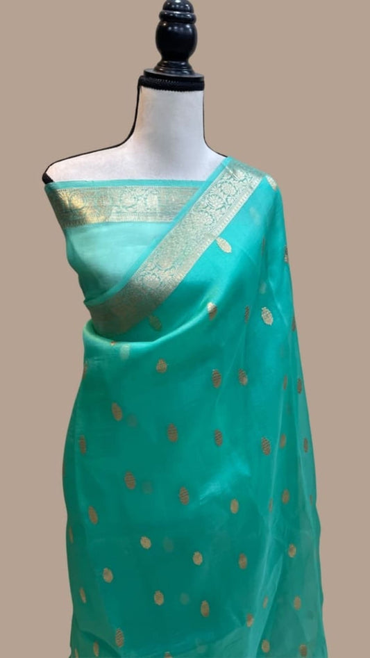 Turquoise blue Banarasi silk saree with gold zari pallu and small gold leaf motifs