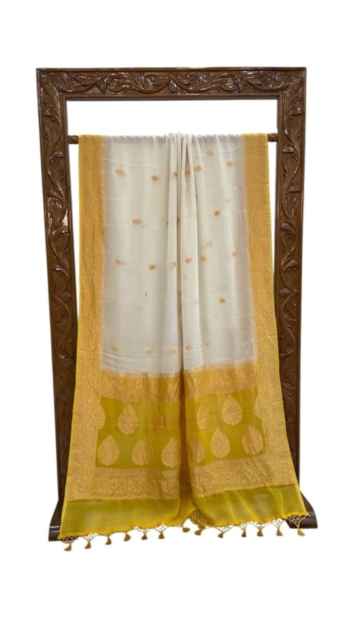 White saree with gold lower band, small motifs, and tassel fringe hem