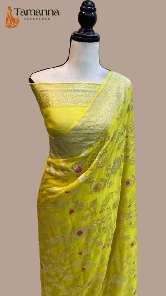 Yellow saree drape on mannequin, allover jaal pattern with floral meenakari accents