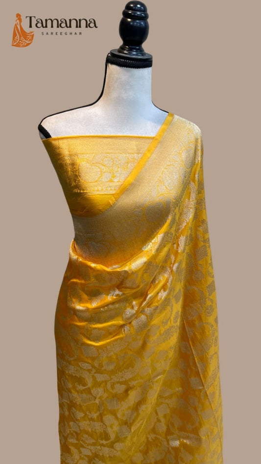 Yellow Banarasi silk saree with pallu pleats and gold jaal pattern